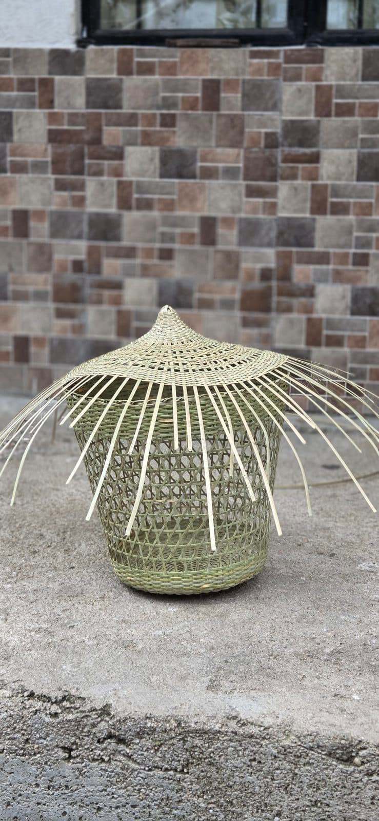 A woven bamboo form part-finished, spokes still untrimmed